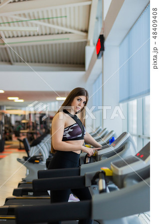 Attractive young sports woman is working out in Attractive young sports woman is working out in 48409408