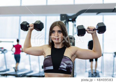 Very beautiful girl trains shoulders with Very beautiful girl trains shoulders with 48409583