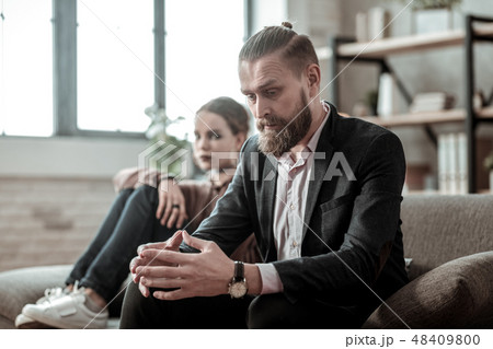 Bearded father speaking about divorce with wife to his daughter 48409800