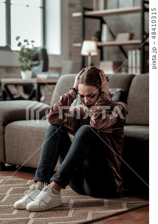 Teenage girl having strong headache after big depression Teenage girl having strong headache after big depression 48410315