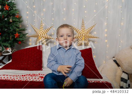 Little boy in the New Year's decor. New Year 2019. 48410332