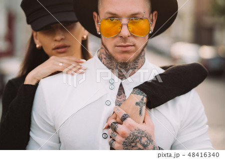 Girl hugging her boyfriend on the street 48416340