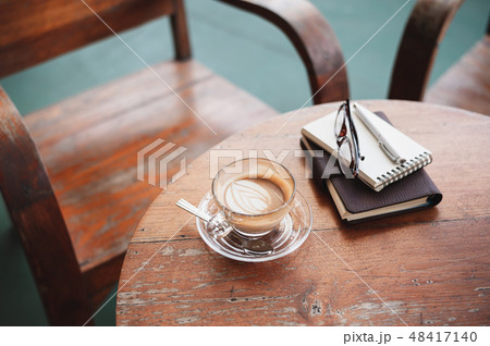Coffee cup on rustic wood table Coffee cup on rustic wood table 48417140