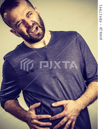 Man feeling liver ache pain Man feeling liver ache pain 48417941