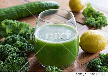 Green juice with kale, cucumber, and lemon Green juice with kale, cucumber, and lemon 48418837