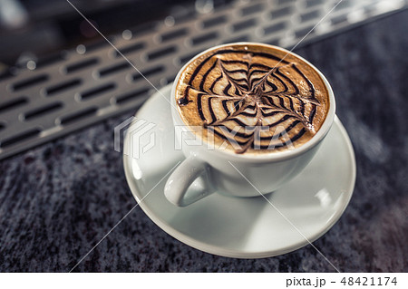 Coffee art artistic pattern on latte or cappuccino Coffee art artistic pattern on latte or cappuccino 48421174