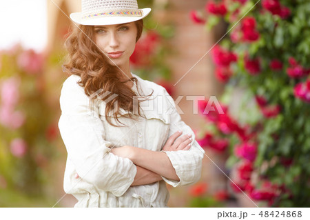 Summer girl in garden 48424868