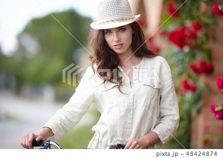 Summer girl in garden 48424874