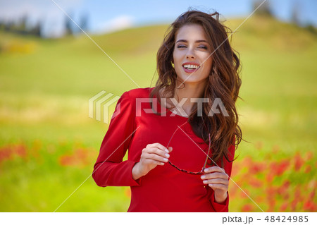 beautiful woman on cereal field in summer 48424985