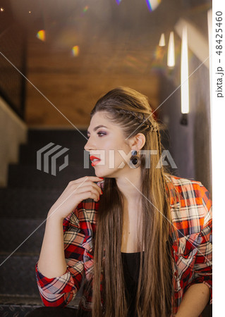 Beautiful and sexy girl posing for a photographer Beautiful and sexy girl posing for a photographer 48425460