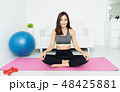 Health concept. Attractive young Asian woman sitting on mat  pra 48425881