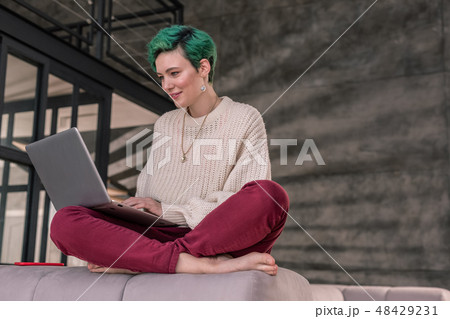 Successful businesswoman typing business letter to her partner Successful businesswoman typing business letter to her partner 48429231