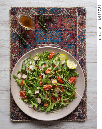 Asian salad with quinoa and arugula. Top view. 48435781