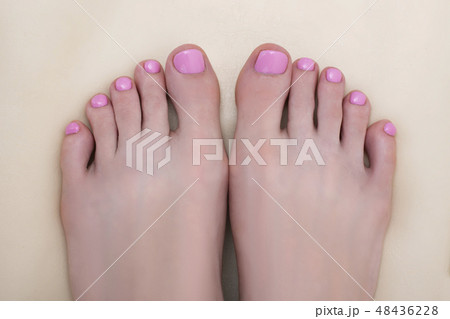 Female feet with a pink pedicure. Beauty saloon Female feet with a pink pedicure. Beauty saloon 48436228