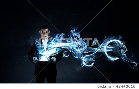 Man magician with cylinder hat Man magician with cylinder hat 48440610