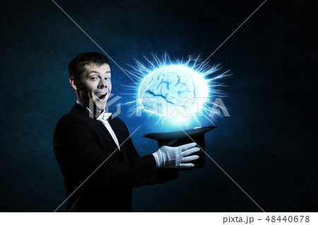 Man magician with cylinder hat 48440678