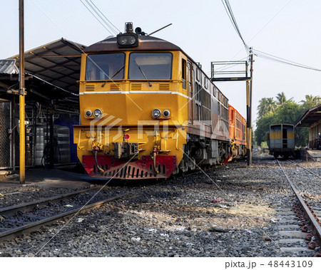 Yeliow train on tracks in phitsanulok, thaland. 48443109