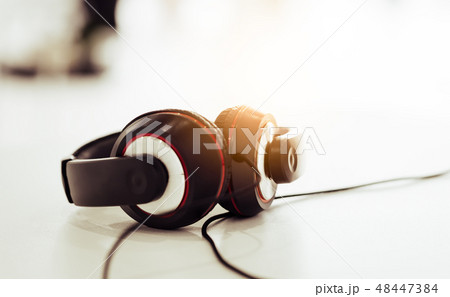 headphone on the white table with light flare 48447384
