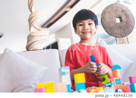 boy stacking Toy blocks on a for educational 48448130