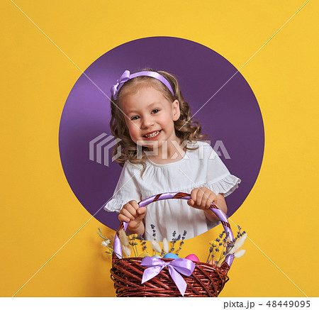 Girl with painted eggs Girl with painted eggs 48449095