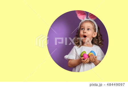 Girl with painted eggs 48449097