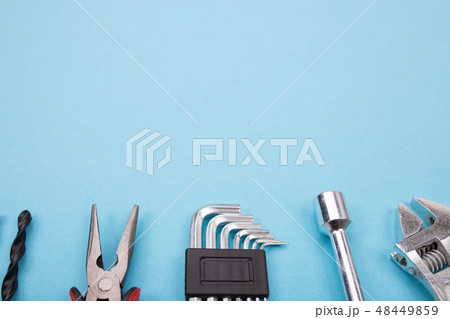 Set of different tools on blue background Set of different tools on blue background 48449859