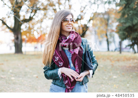 beautiful girl in sunglasses, scarf and jacket beautiful girl in sunglasses, scarf and jacket 48450535