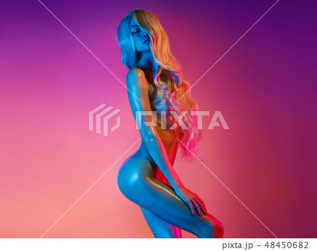 Nude sexy blonde in colorful light. Night club dance 48450682
