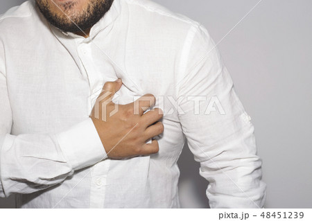 Man having a pain in the heart on white. 48451239