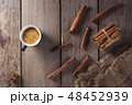 Cup of espresso and cinnamon on the table 48452939