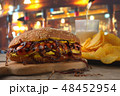 Brutal hot dog with onions, beer and chips 48452954