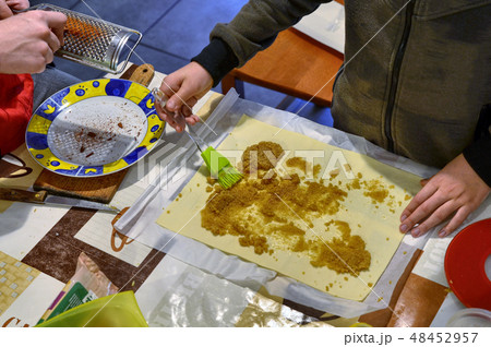 Preparation of apple strudel in the family Preparation of apple strudel in the family 48452957