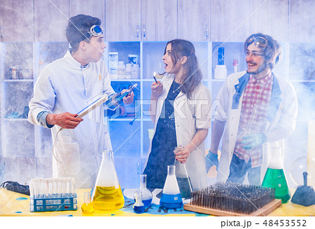 Funny scientists standing in smoke Funny scientists standing in smoke 48453552