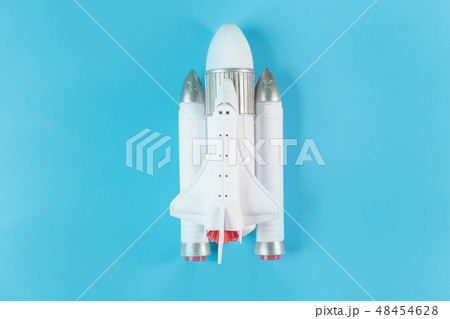 The  close up image space ship on blue background. 48454628