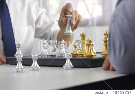 Businessman playing chess game, business strategy Businessman playing chess game, business strategy 48455754