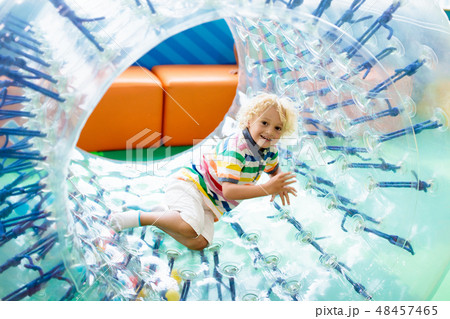 Child play in roller wheel. Kids on trampoline. 48457465