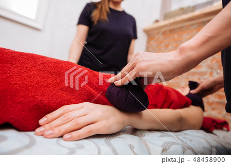 Expert masters in SPA center providing relaxing session to client Expert masters in SPA center providing relaxing session to client 48458900
