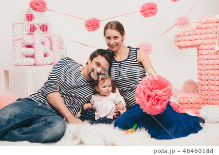 child in the arms of the mother and father 48460188