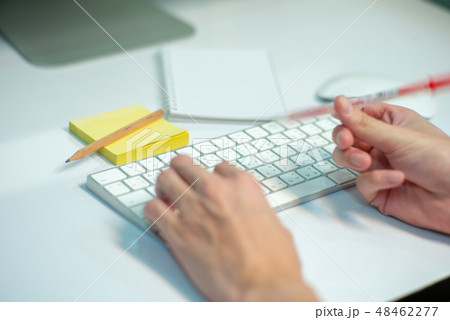 Selective focus on white keyboard of desktop Selective focus on white keyboard of desktop 48462277