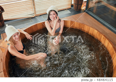 Group of caucasian diverse friends enjoying jacuzzi in hotel spa Group of caucasian diverse friends enjoying jacuzzi in hotel spa 48464115