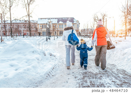 A young, seven woman mom with son 3-6 years old and girlfriend returning home after a sporting event A young, seven woman mom with son 3-6 years old and girlfriend returning home after a sporting event 48464710