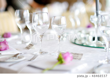 Beautiful table setting with crockery and flowers Beautiful table setting with crockery and flowers 48468537