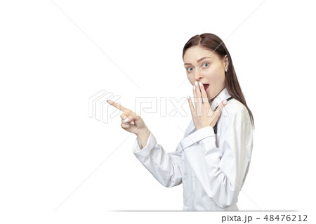 surprised doctor points to the side surprised doctor points to the side 48476212