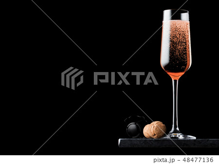 Elegant glass of pink rose champagne with cork 48477136