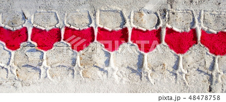 Tire track on a snow with red wine glass patterns 48478758