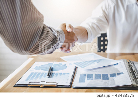 Successful of businessmen handshaking and business people after 48483578