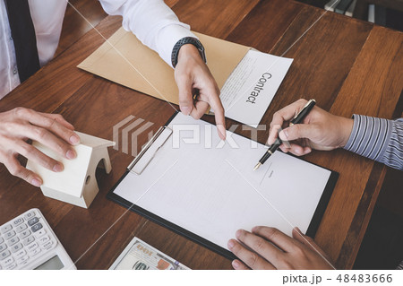 Business Signing a Contract Buy - sell house, Man sign a home in Business Signing a Contract Buy - sell house, Man sign a home in 48483666