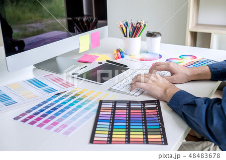 Image of male creative graphic designer working on color selecti Image of male creative graphic designer working on color selecti 48483678