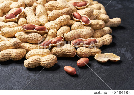 Raw peanut on black table. Selective focus. Raw peanut on black table. Selective focus. 48484102