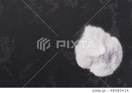 Pile of baking soda on a black background.Flat lay 48485414